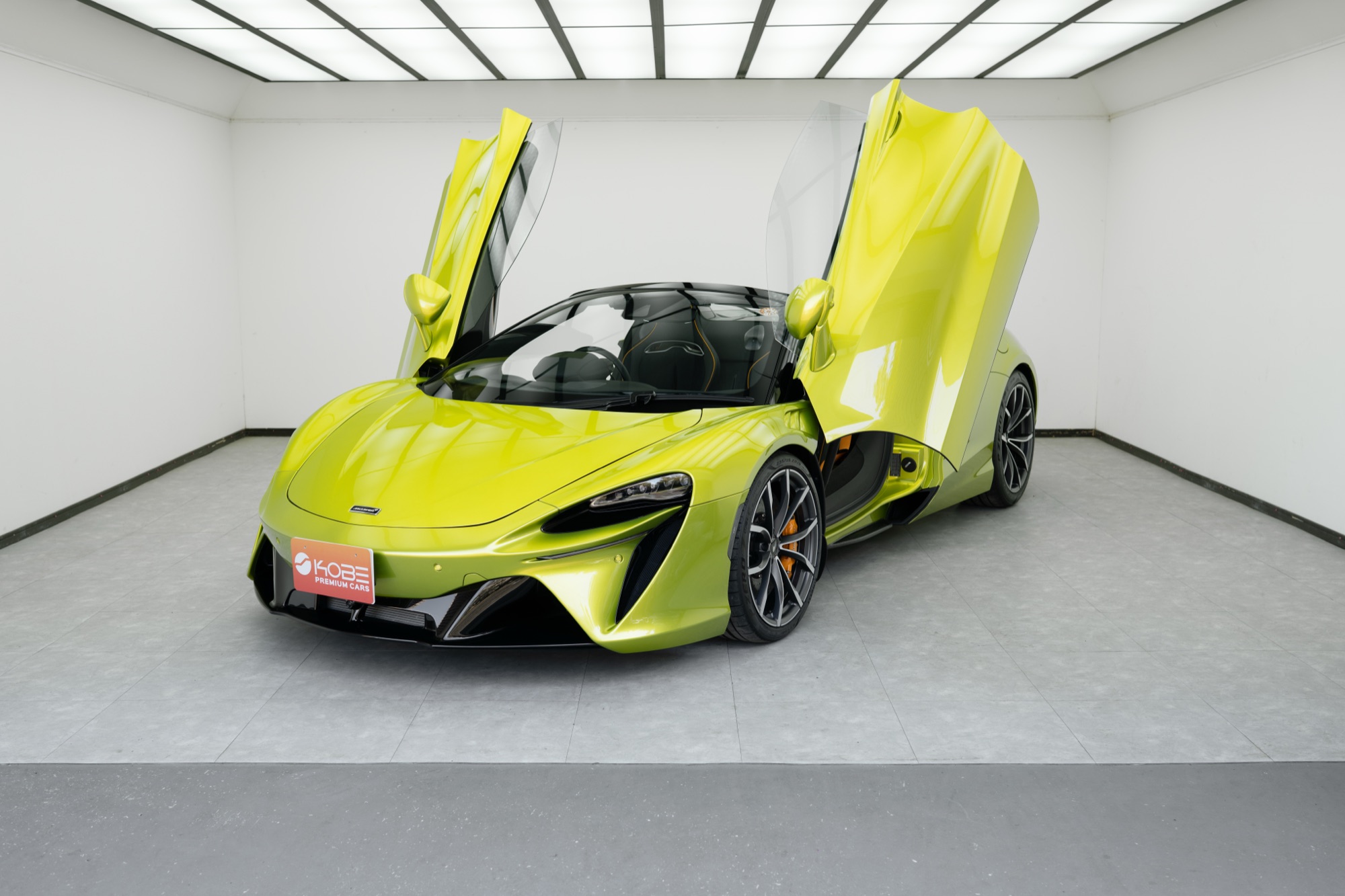 Green McLaren Artura with doors up